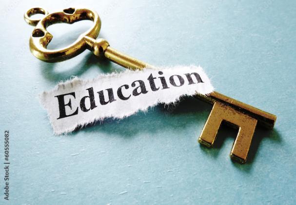 blue background with key and Education written on paper