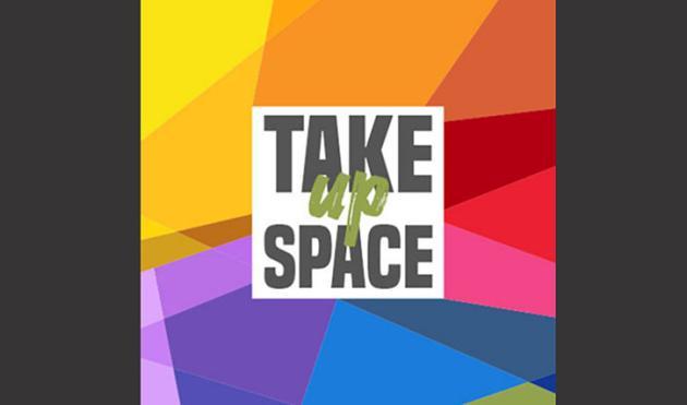 picture of a mosaic with rainbow colors with the words "Take Up Space" in the middle